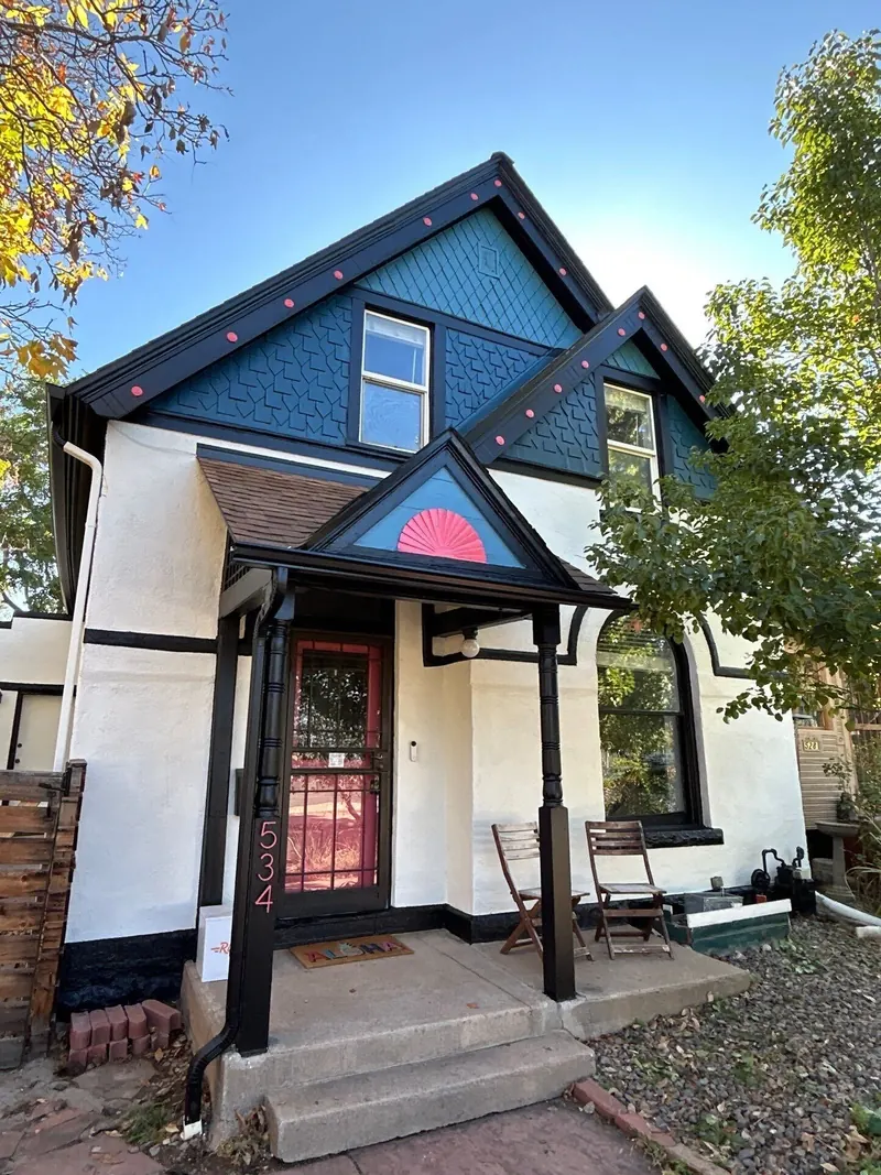 Repainted Victorian home in teal and pink in Denver